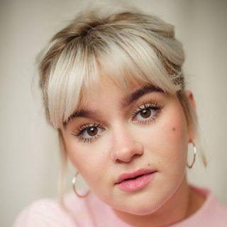 This is a headshot of Lola Shalam looking directly at the camera.