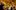 A group of people are shown around the Sam Wanamaker Playhouse theatre, they look up to the ceiling